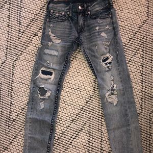 Ripped jeans with dark blue stitching